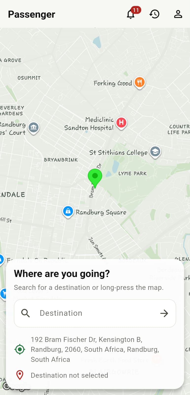 AfrolandX Rides passenger screen showing a map and destination search